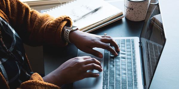 Person using black and silver laptop. Photo by Daniel Thomas on Unsplash