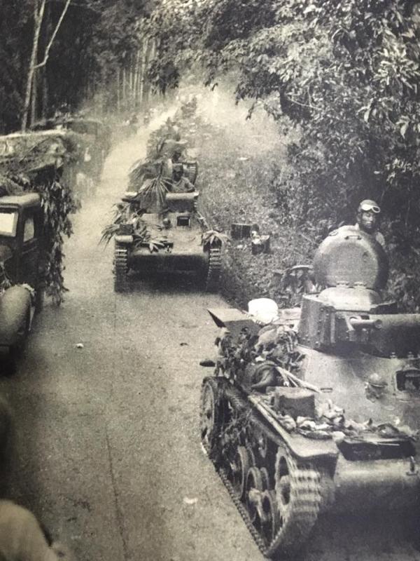Japanese Type 97 Te-Ke tanks followed by their bicycle infantry behind during the Battle of Kampar in Perak.