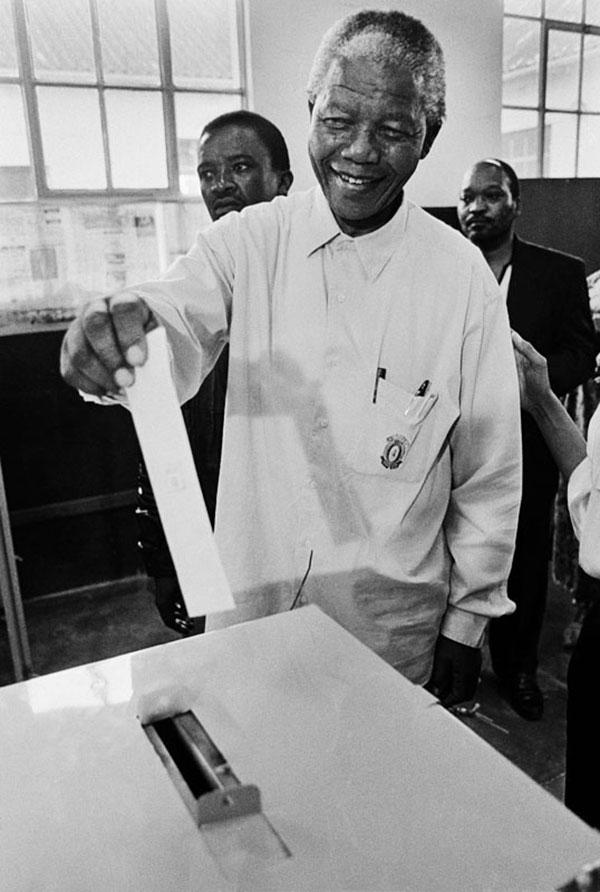 Nelson Mandela casting his ballot at the Ohlange School in Durban in the 1994 parliamentary elections, the first free election in South Africa’s history. It was taken by the Election Commission’s official photographer, Paul Weinberg. [FREE TO USE]