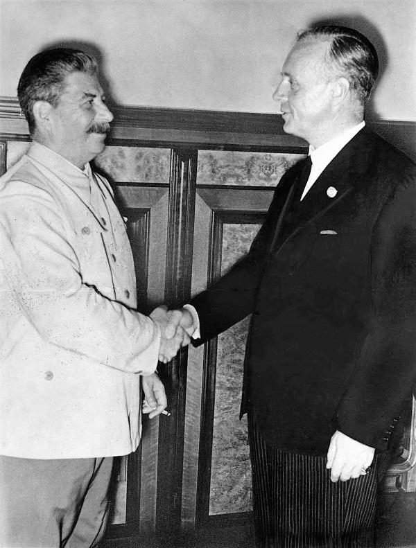 Stalin and Ribbentrop after signing the non-aggression pact. Later Violated By The Third Reich in 1941.